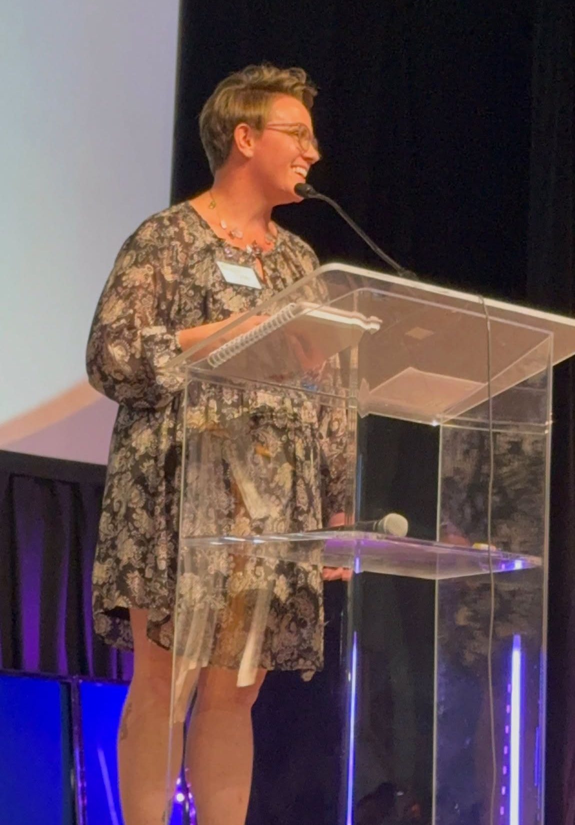 Candy delivering a conference keynote at Compassion & Hope Banquet