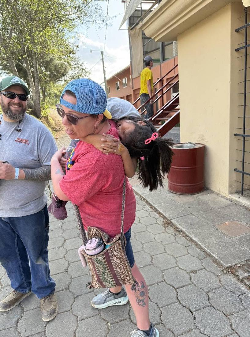 Candy hugging a child at Casa Angelina in Guatemala