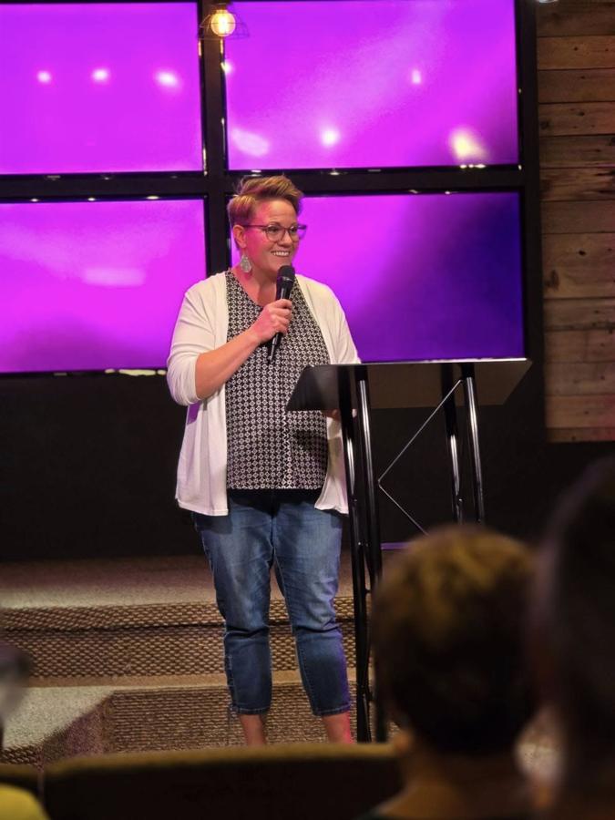 Candy speaking at a church event